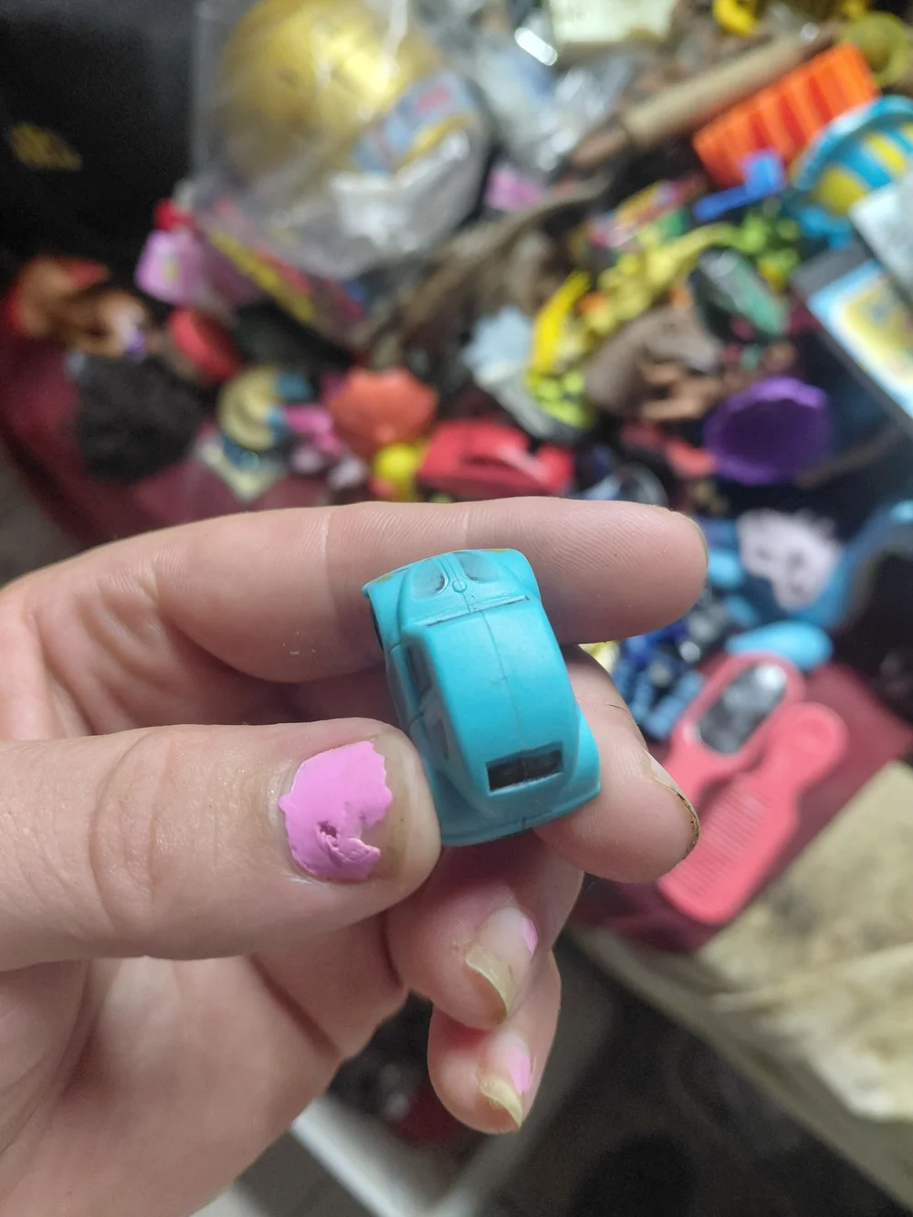 light-blue plastic toy Volkswagen Beetle (bug) car. [1] (https://boonsartshop.co